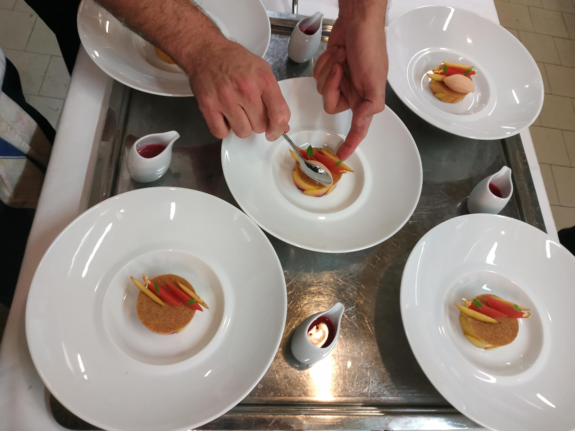 Sous chef arranging plate